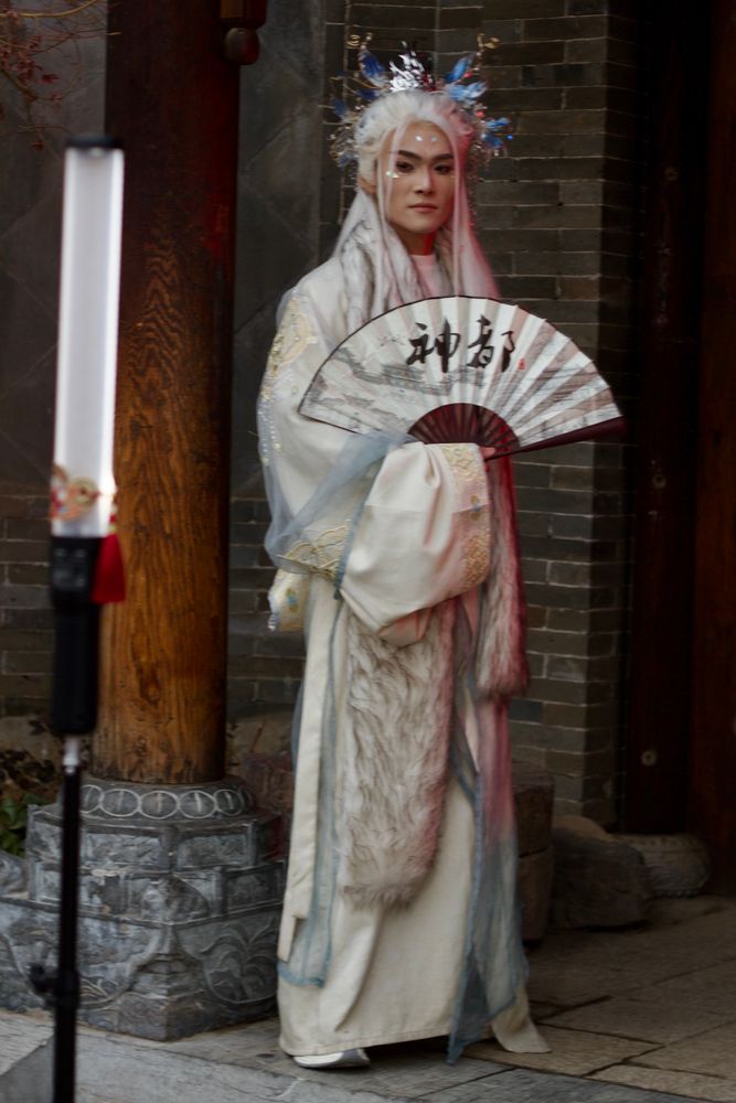 A very handsome Chinese man in a white hanfu gown