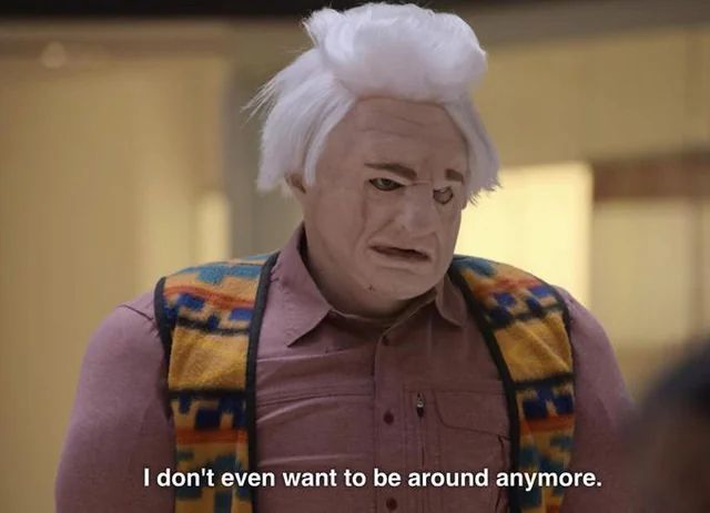 A still from I think you should leave with Tim Robinson wearing a terrible looking disguise and the text reading “I don’t even want to be around anymore”
