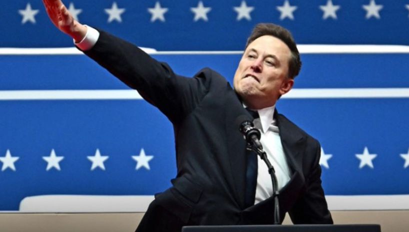 Elon Mush cunt face making a seig heil salute - the nazi twat