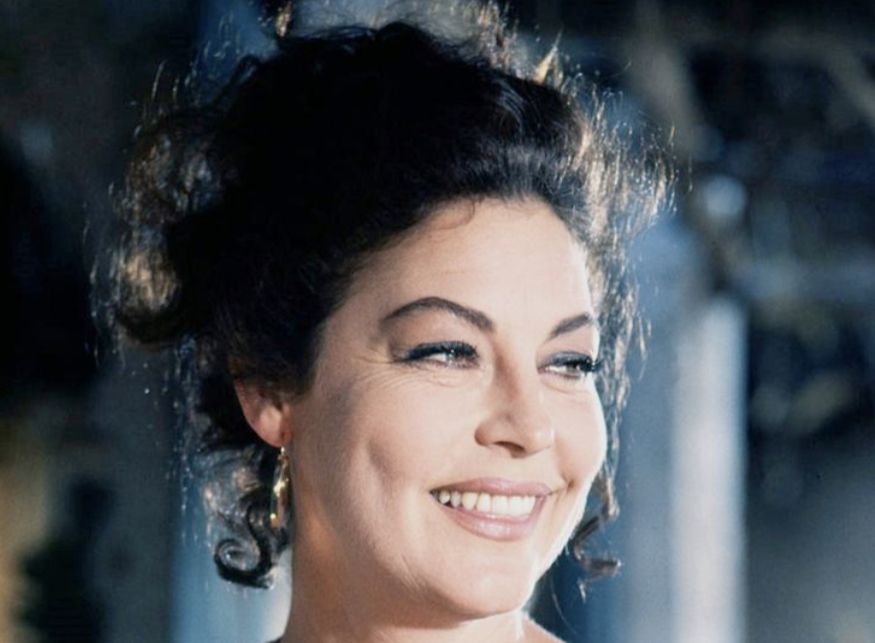 Close up colour pic of Ava aged 40-41 with hair curled and pinned up, smiling.