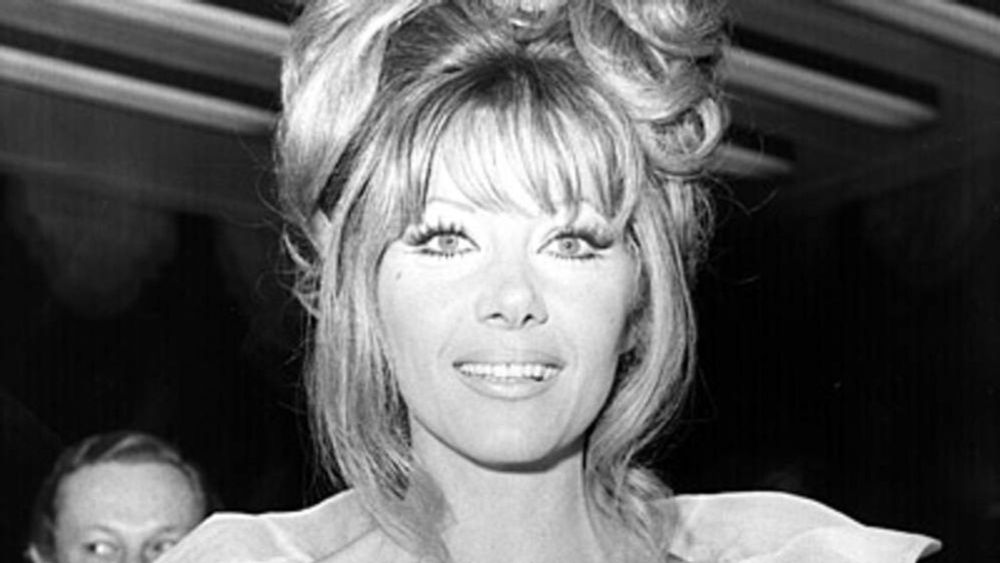 Photos of stunning gorgeous glamorous Polish actress Ingrid Pitt in the 60s/70s, she has long blonde curled hair, and regularly portrayed a vampire.