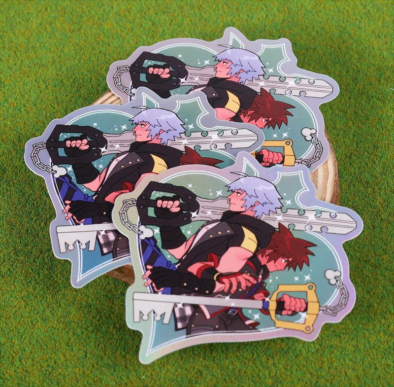 Sora and Riku back to back, holding their keyblades, as a sticker.