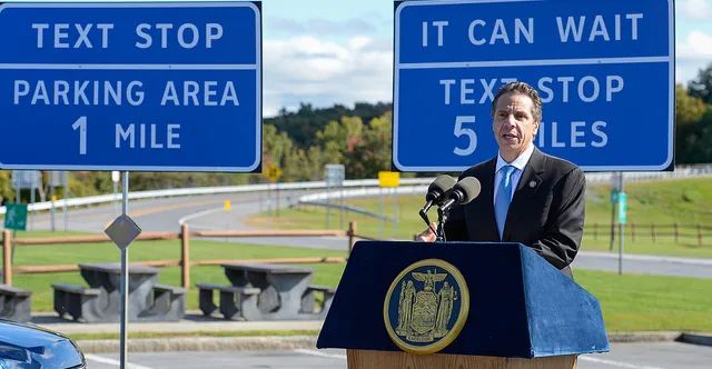A photo of New Yorks new signs saying “Text stop. Parking area 1 mile” and “it can wait. Text stop 5 miles”