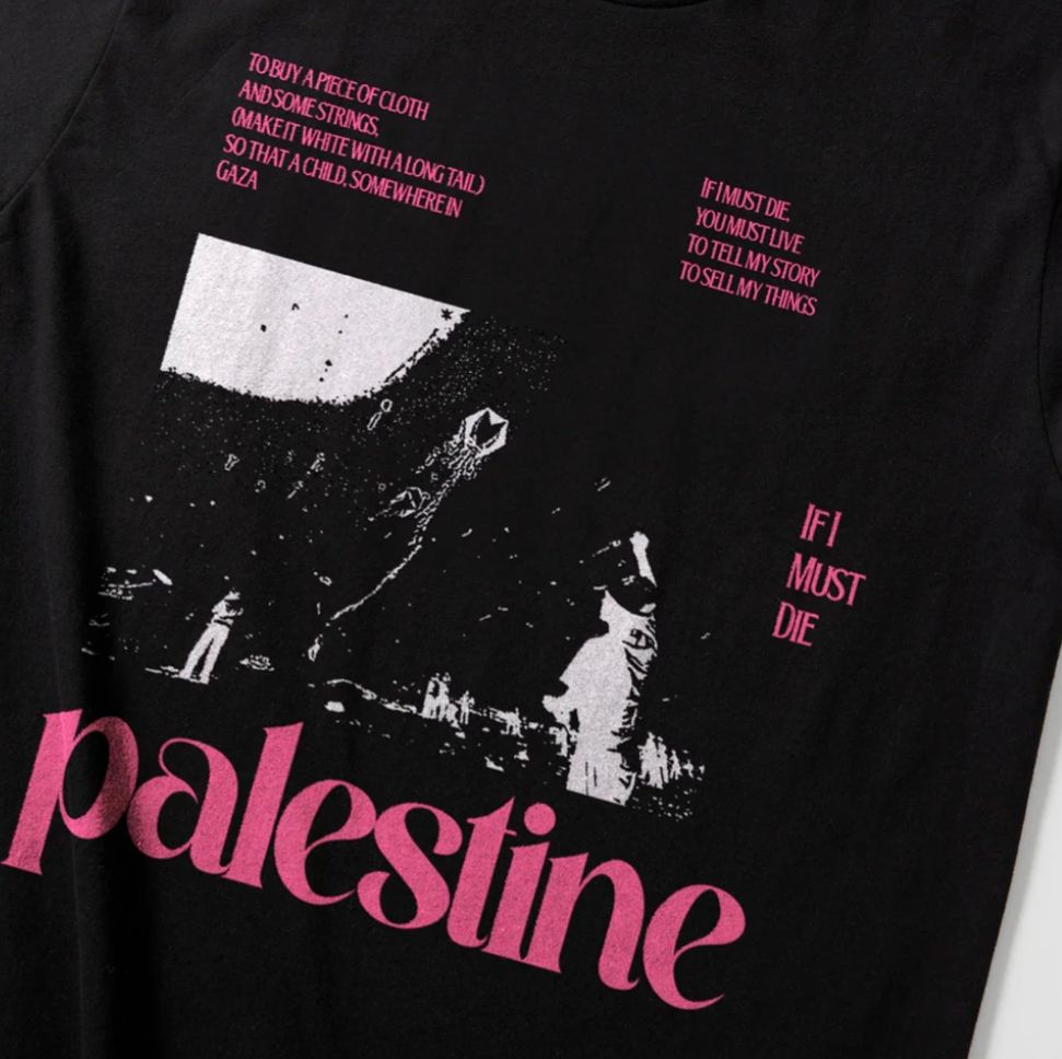 A black and white graphic of people flying a kite with segments of Refaat Alareer's poem "If I Must Die" on a black t-shirt