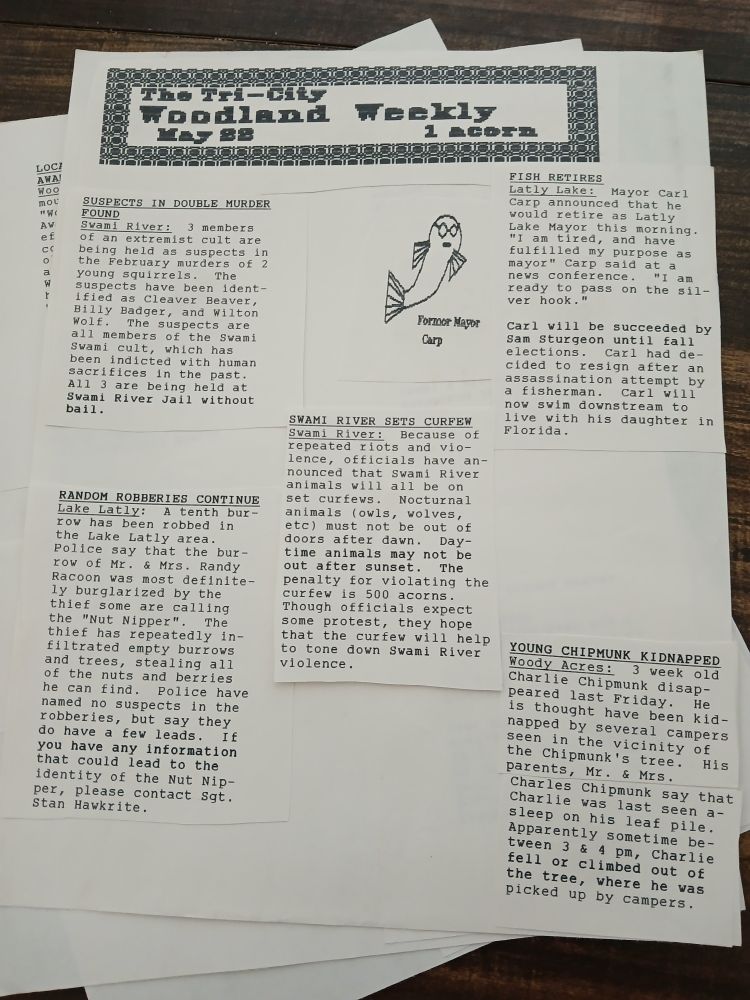 "The Tri-City Woodland Weekly" newspaper, May 1988. 

It's a bunch of typed and cut "news articles" pasted together. They mostly appear to be about murders, violent crime, and kidnapping. Also about a fish retiring as mayor, I guess??