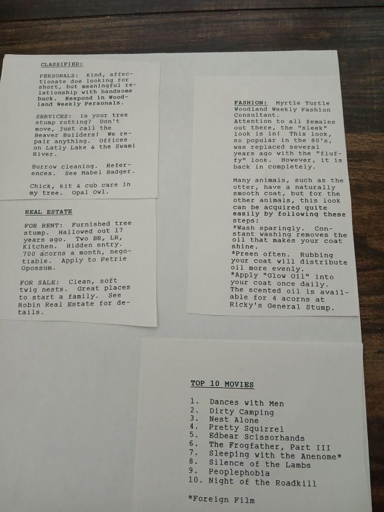"The Tri-City Woodland Weekly" newspaper, May 1988. 

It's a bunch of typed and cut "news articles" pasted together. Thid page is cheesy woodland themed classifieds, real estate ads, and a fashion column written by a turtle. Also a list of "Top 10 movies" that are all shitty, early Karla puns.