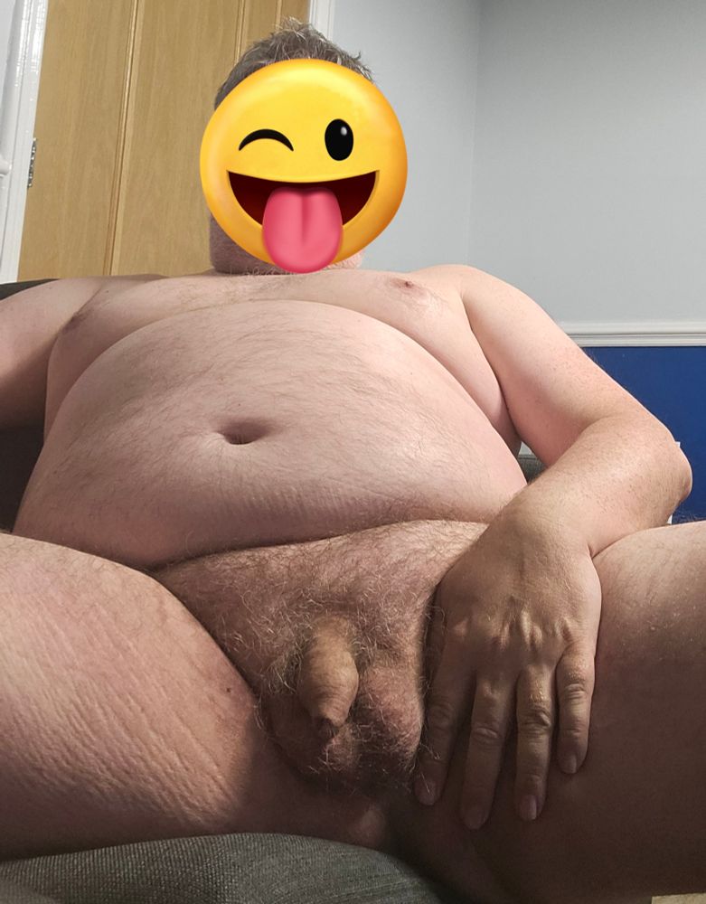 A pic taken from below showing me naked on the sofa 