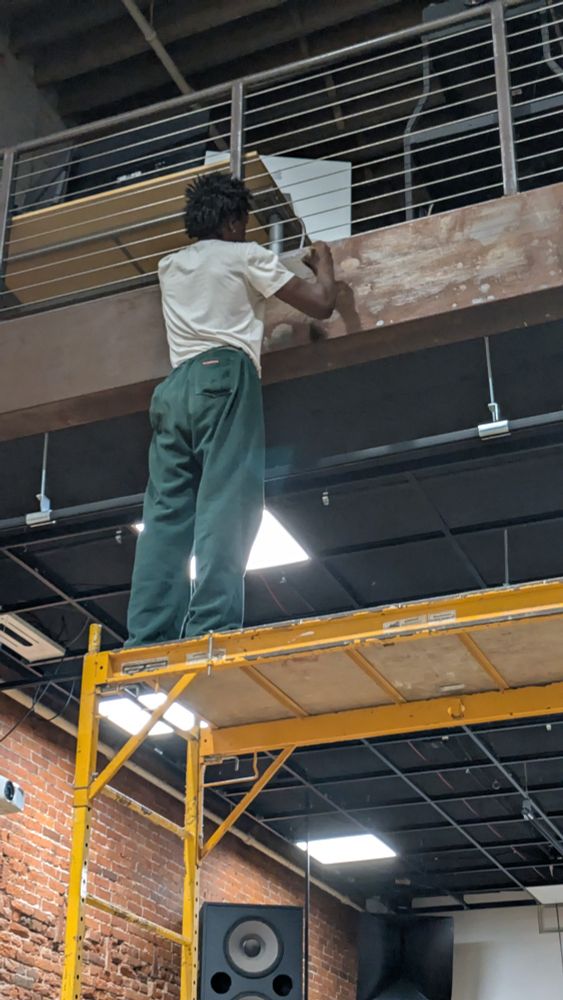 Masc applies rat rod finish to rusty Corten steel facing on mezzanine edge
