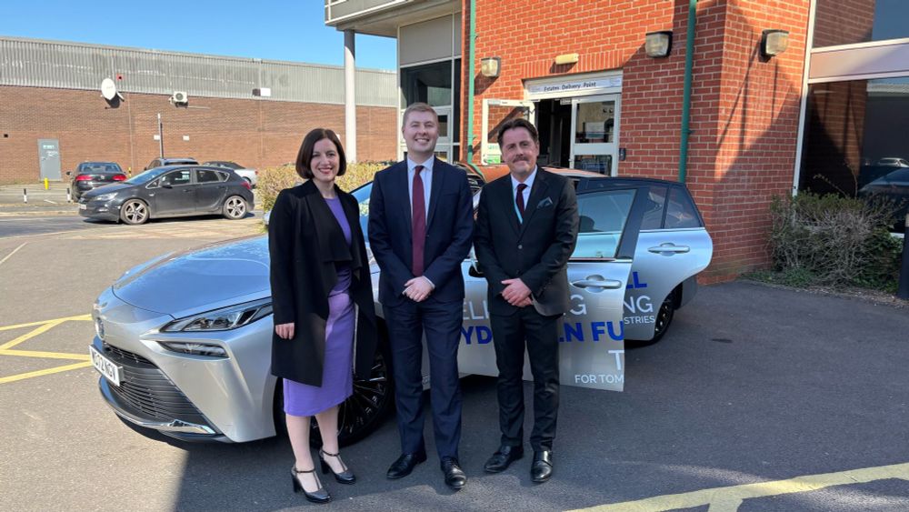 Photograph showing Rt Hon Bridget Phillipson MP, Secretary of State for Education, with Jacob Collier MP, Member of Parliament for Burton & Uttoxeter, and John Beaty, Principal, outside Burton & South Derbyshire College with an innovative hydrogen-powered car. Burton, April 2025.