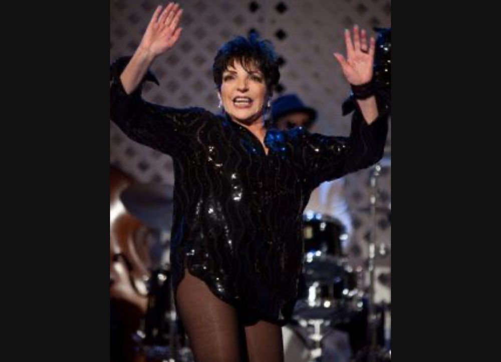 Liza wearing sparkly button down no pants just tights looking fab 