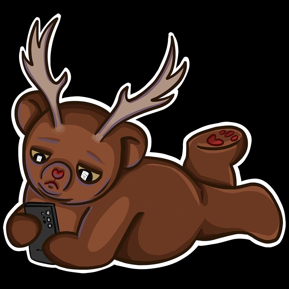 A teddy bear with antlers lying on his belly staring at a phone
