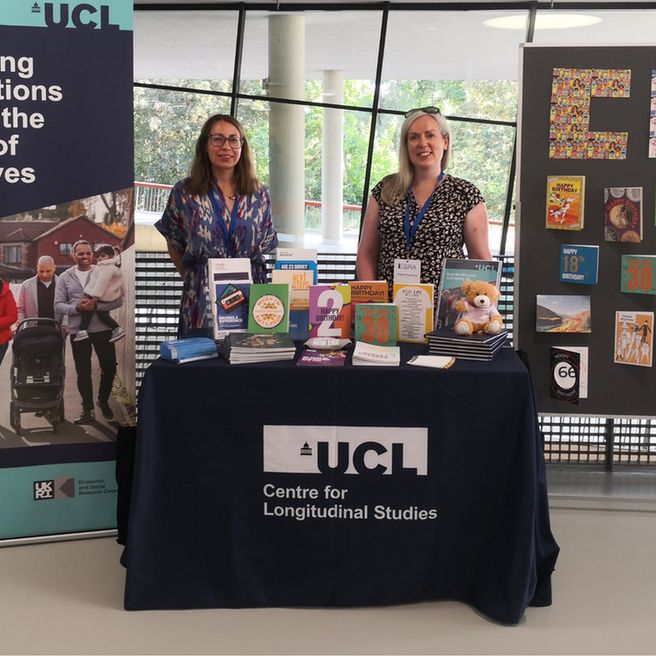 Two women at a conference stand