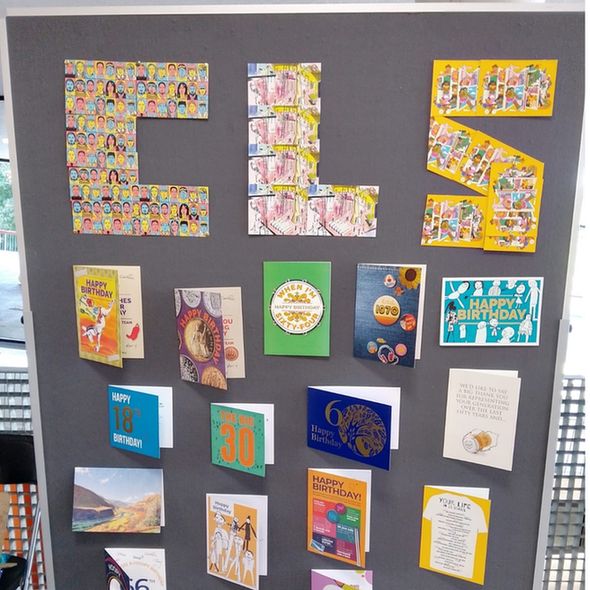 Cards on a noticeboard spelling out CLS