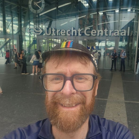 Man with glasses outside Utrecht Central train station