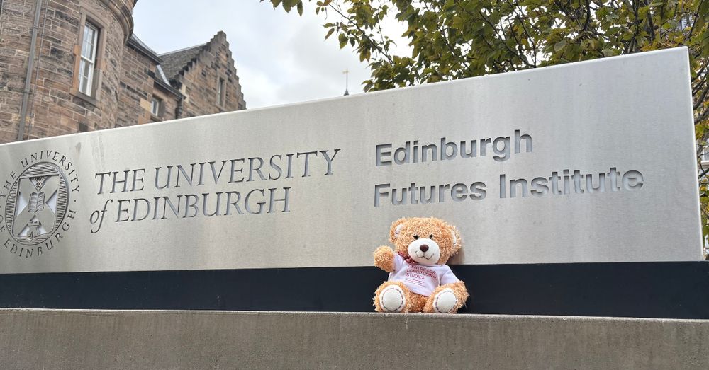 Teddy bear in front of University of Edinburgh sign