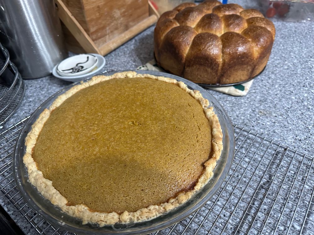 The rolls from the last image moved one step over, making room for a pumpkin pie.