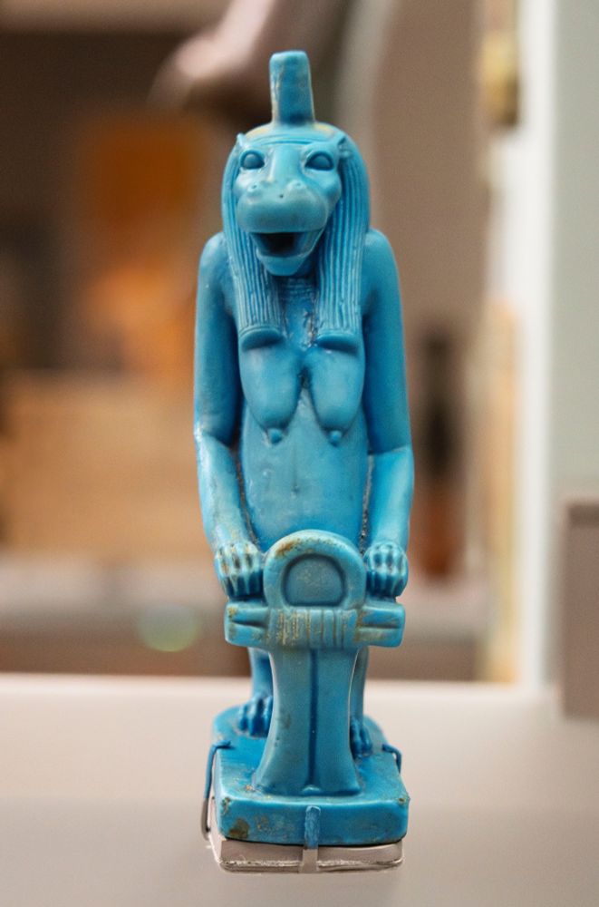 In all likelihood, this statuette represents the goddess Taweret, whose domain was the protection of pregnant women, especially during childbirth. Her menacing image, intended to frighten away demons and other deadly creatures, combines human, hippopotamus, crocodile, and lion attributes. The post on her head probably supported a metal crown in the shape of a sun disk, surmounted by either feathers or horns. The stylized symbol under her front paws can be best interpreted as the sa amulet. Although Taweret was worshipped in both secular and sacred settings, this statuette's almost perfect condition, exceptional craftsmanship, size, and iconography suggest that it was created for a temple—possibly for the "birth house" where this goddess was linked with Isis.

Ptolemaic, Egypt, Northern Upper Egypt, Qena area, ca. 332-30 BCE. Glassy faience.

Met Museum, New York (26.7.1193)