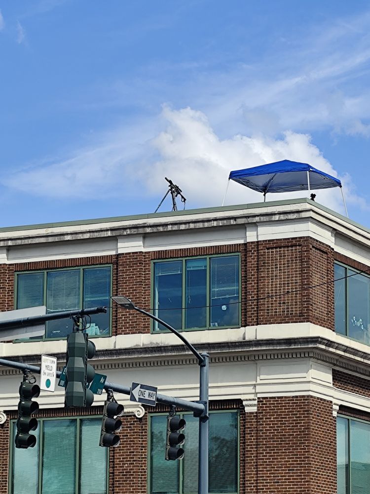 Sniper rifle on top of a building 