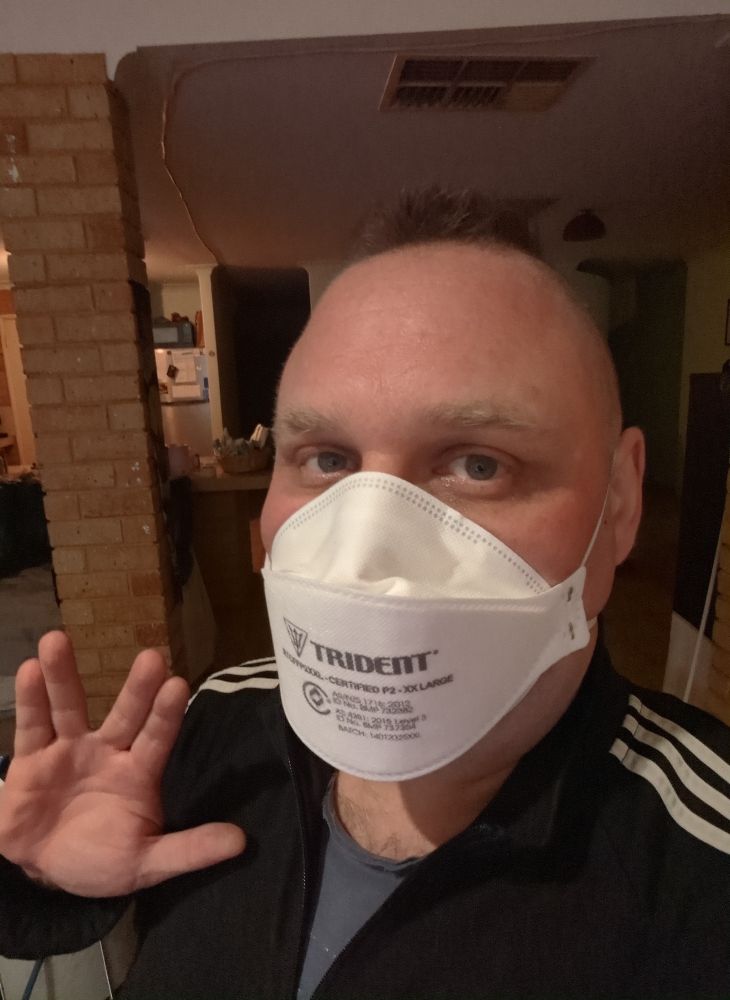 a selfie of me wearing a n95 respirator and flashing the vulcan salute 