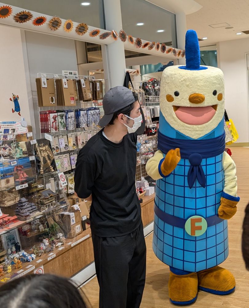It's the Fukuoka Tower mascot (and its assistant) in the lobby of Fukuoka Tower, one of the largest viewing towers in Japan.