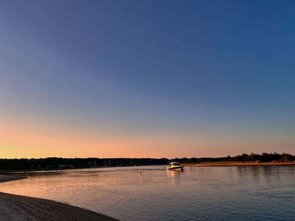 Boat leaving harbor just after sunrise this morning. 