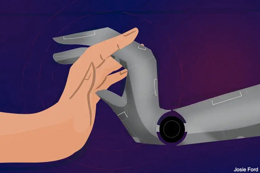 A cartoon showing a human hand (left) clasping fingers with a metallic robot hand (right), against a purple background. Credit: Josie Ford.