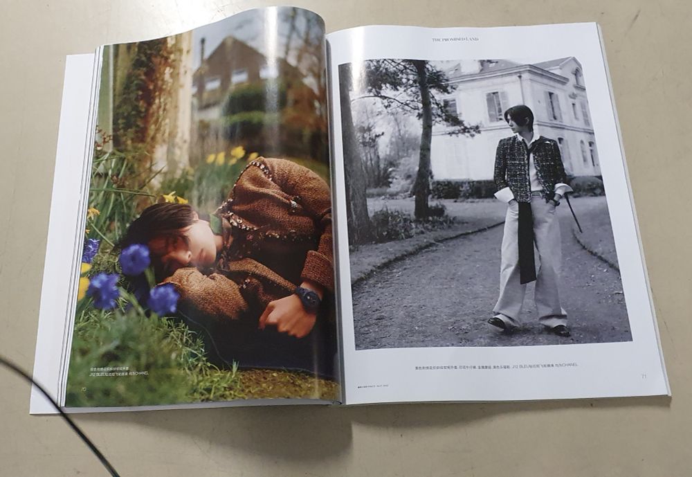 More Photos of Wang Yibo from chinese Vogue. Looking handsome and fashionable in all. One picture he is laying in some grass and flowers (blue and yellow). The other he is standing in the street