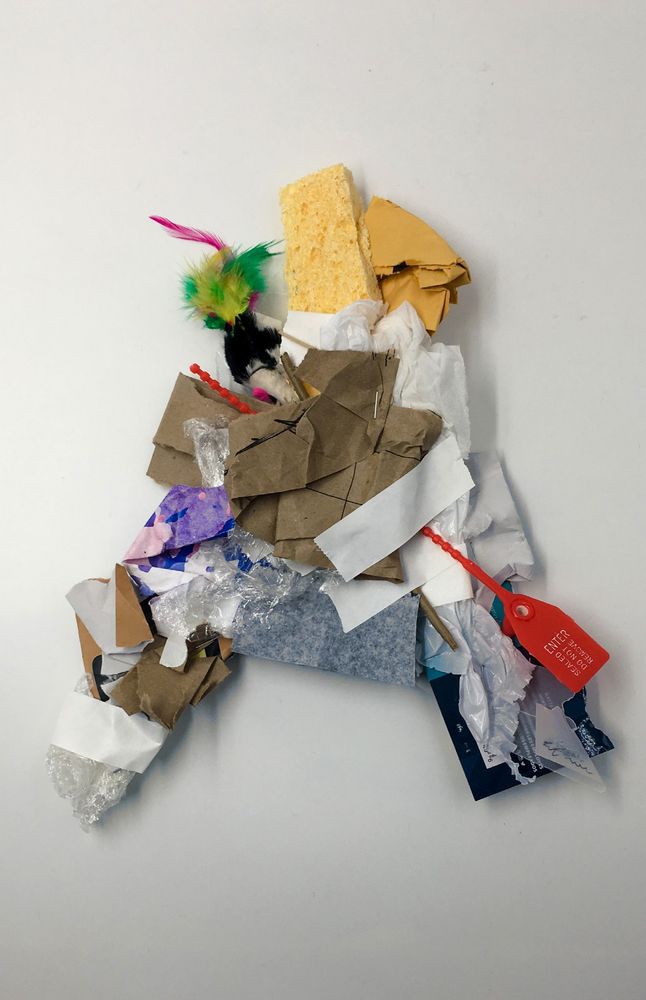 Letter A made out of trash on a white background.