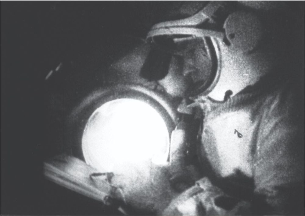 Cosmonaut Alexey Leonov drawing a sketch on the Voskhod-2 Spaceship in 1965.