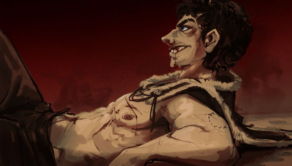 a man grinning laying on the floor, propped on one elbow