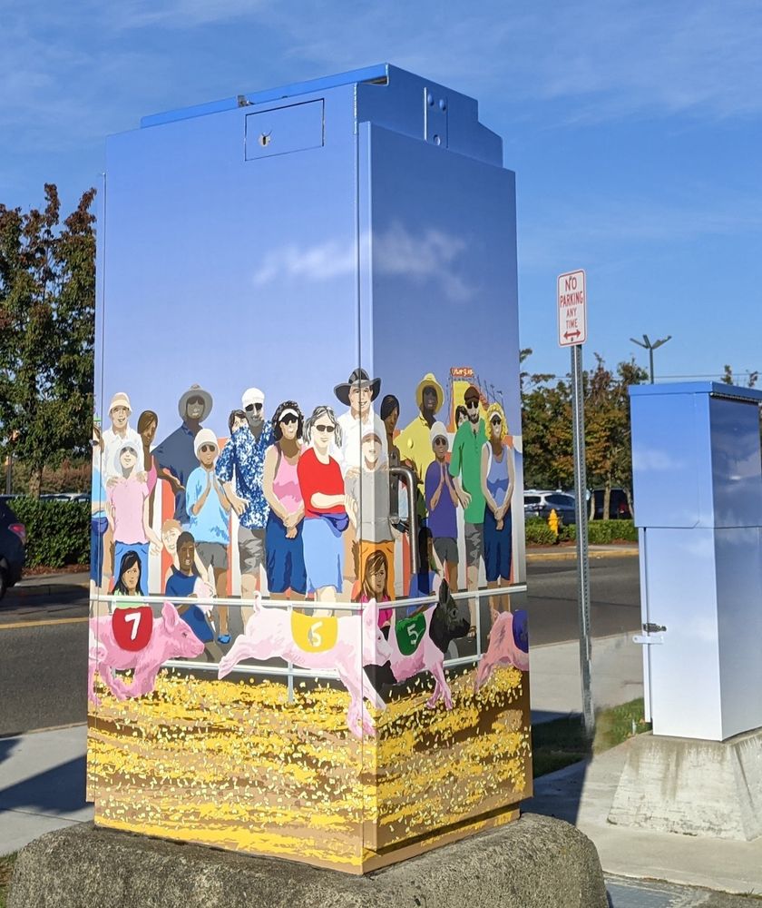 Art depicting a piglet race decorates a signal box near the fairgrounds in Puyallup, Washington.