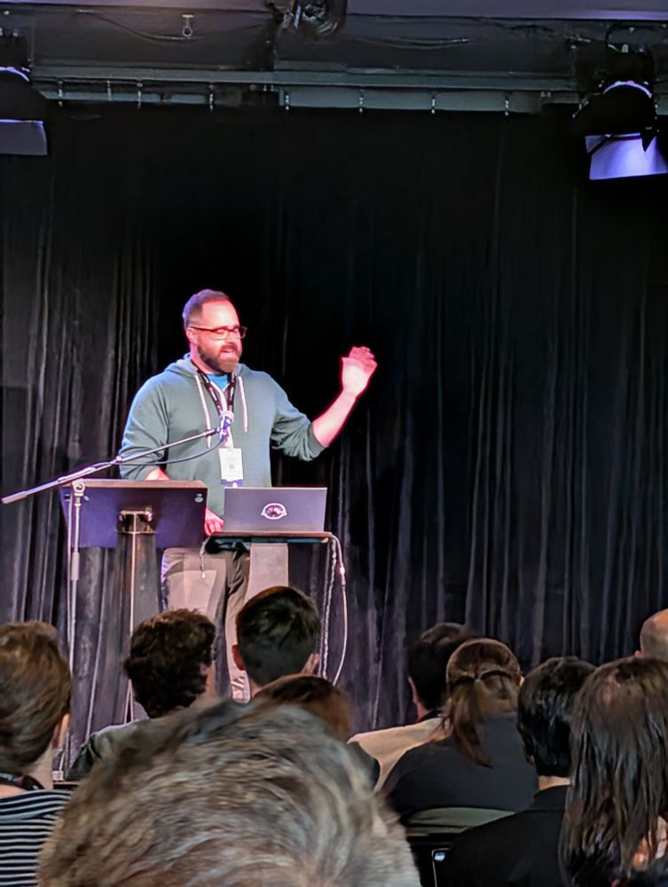 Justin Rastelli on stage at CascadiaJS