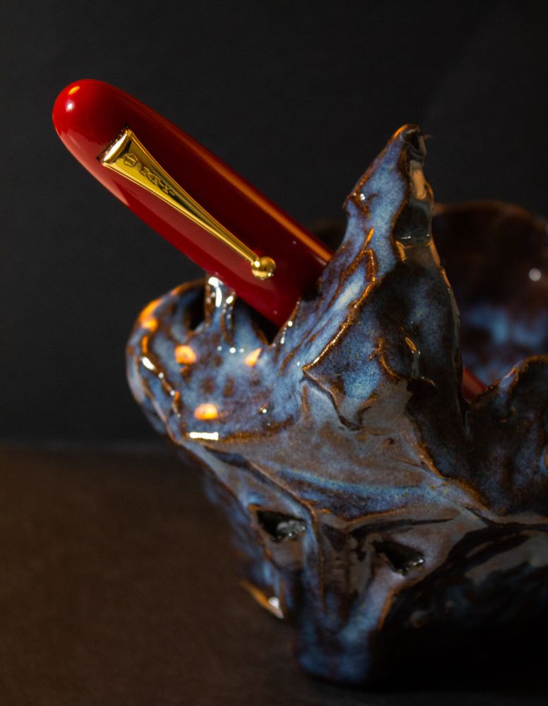 The Viktor pot, in use as a pen jar. An oversized Namiki pen rests in it. 