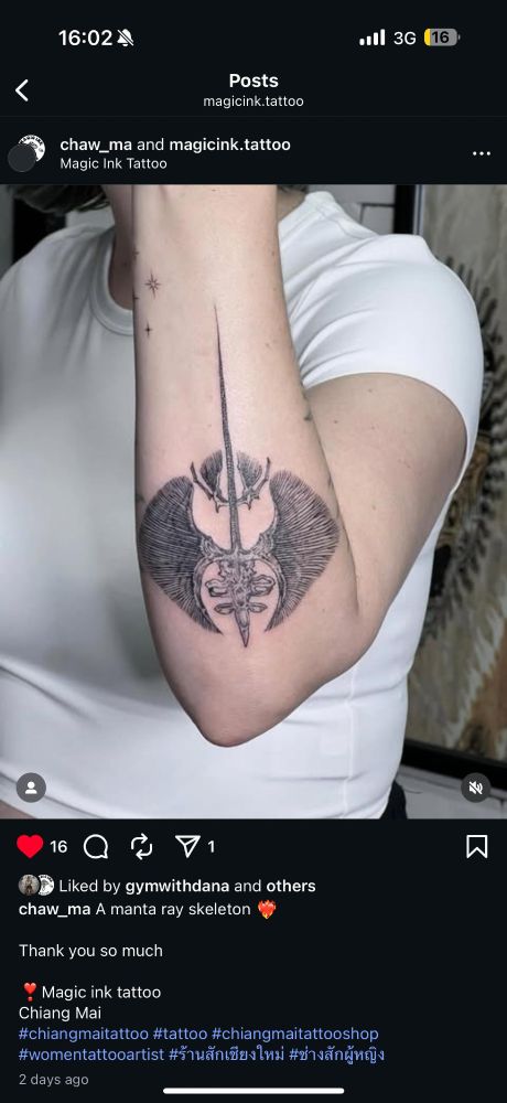 Instagram post screenshot of a bent arm with forearm showing an intricate tattoo of a manta ray skeleton posted by chaw_ma and magician.tattoo