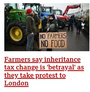 Picture shows protesting farmers with banners reading no farmers, no food