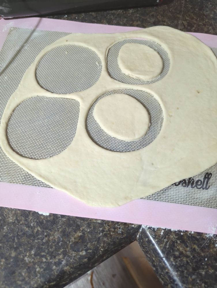 Dough for perogy shells on a silicone mat.