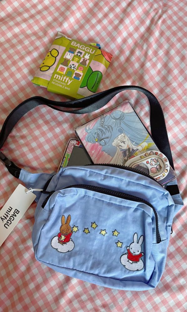 baggu x miffy fanny pack with a kindle paperwhite and kindle fire hd 8 being put inside