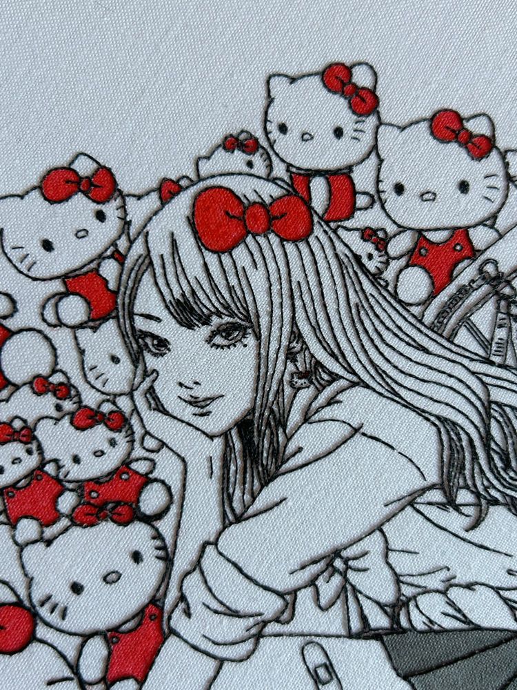close up of hand embroidery by me of tomie and hello kitty from junji ito and sanrio’s collaboration 