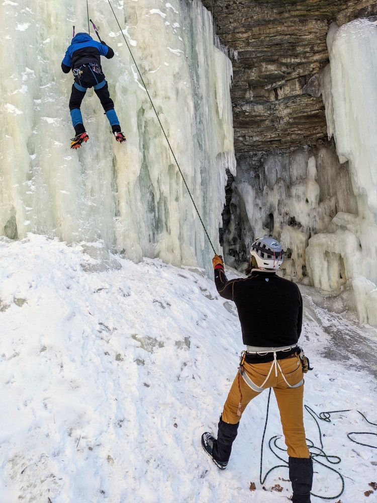 Ice climbers climbing a frozen waterfall