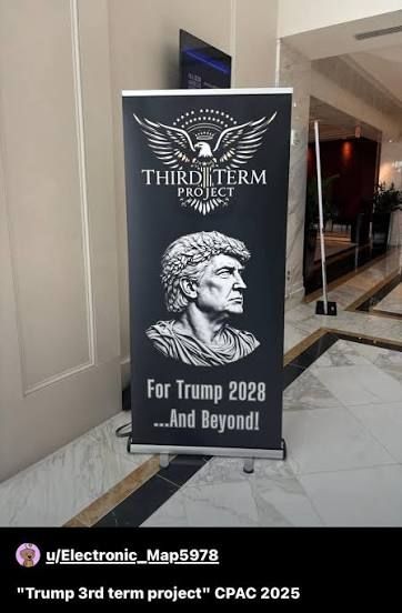 A banner from CPAC 2025. It's black with a white eagle and the words "Third Term Project" at the top. In the middle is an all white photo of Trump's head that makes him look like a Roman Caesar with the toga and leaves around his head. At the bottom says "For Trump 2028... And Beyond."