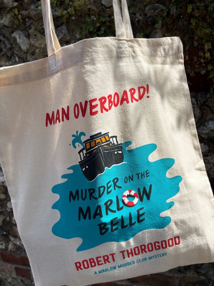 A tote bag with the book's design on the front.