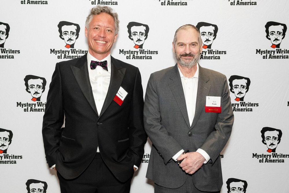 Robert standing next to Scott Frank at the awards ceremony
