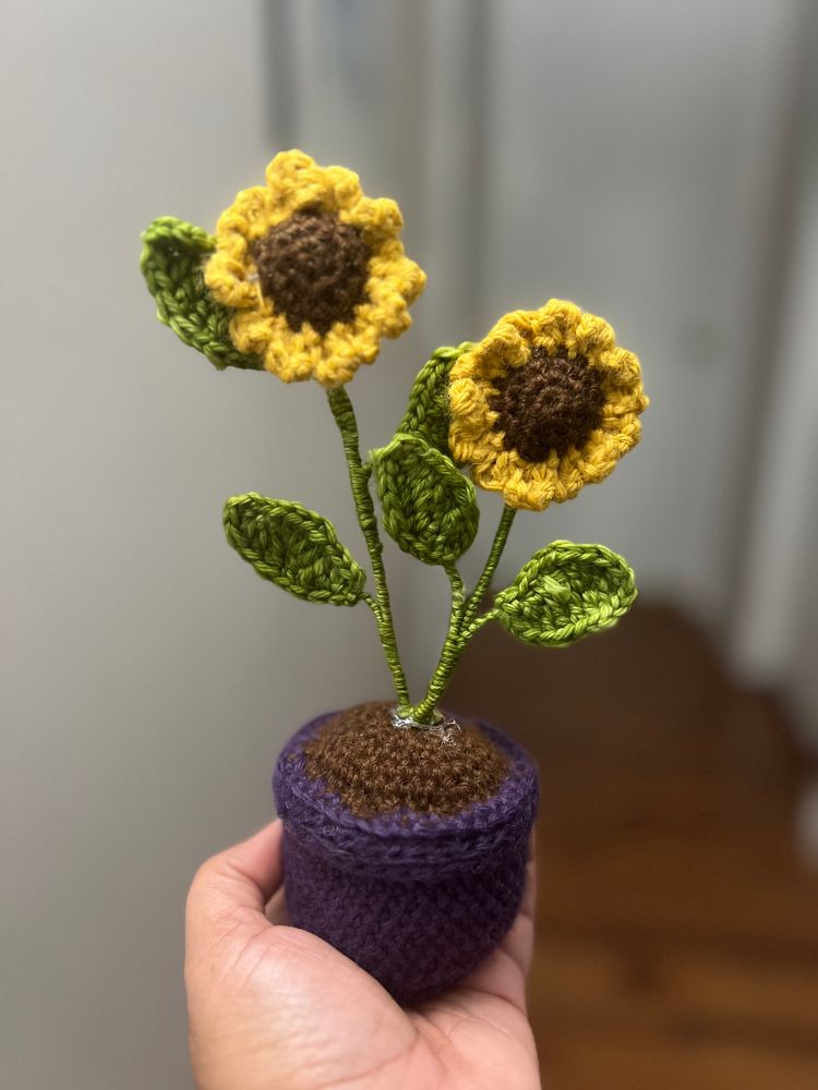 Crocheted sunflowers in a purple pot