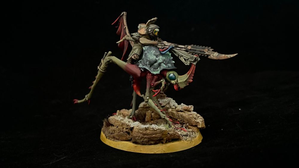 Side view of a Necromunda Ash Nomad riding a Dustback Helamite on a scenic base