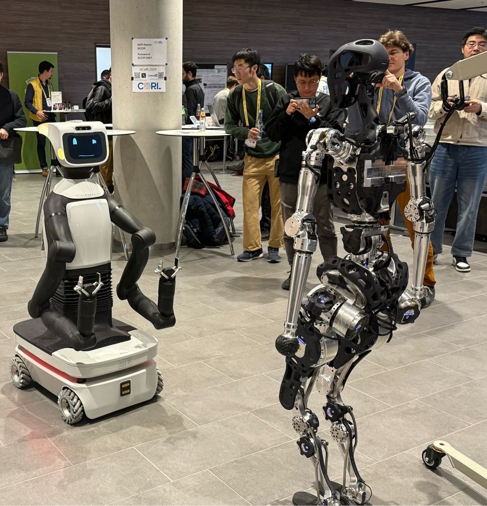 A robot standoff. One with wheels and one with legs. 
