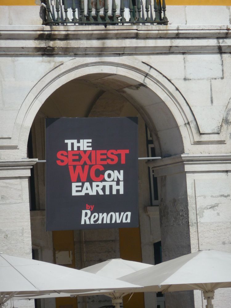 Sign outside a building that reads 'the sexiest WC on earth by Renova' 