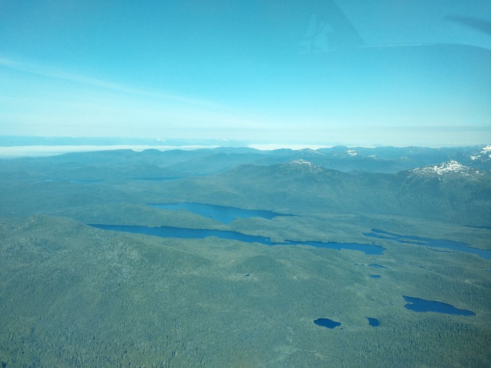 An arial photo of lakes amongst the forests of Xootsnoowú (Admiralty Island, Alaska.)