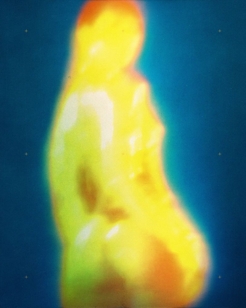 This artwork features a blurred, heat-map-like depiction of a woman in vivid yellow and orange tones against a gradient blue background, with glowing edges and small crosshairs adding subtle detail. This artwork was made by Graphic Designer, Bradley Varndell.

https://www.instagram.com/bradleyvarndell/

https://www.behance.net/BradleyVarndell#