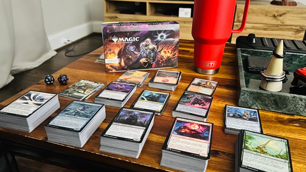 Shows organized piles of cards, based on color identity and rarity.