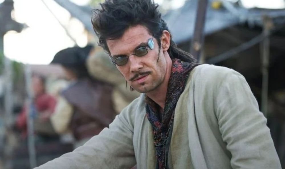 A picture of Jack Rackham from Black Sails (a white man with questionable facial hair) wearing four lensed sunglasses (I'm as confused as you are)